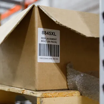 cardboard box with barcode label on a racking shelf
