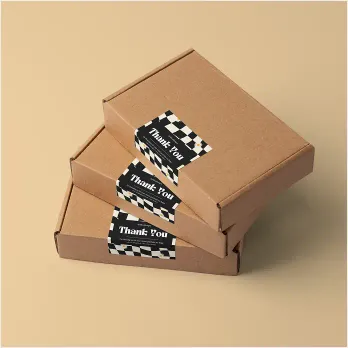 stack of cardboard boxes with thank you stickers