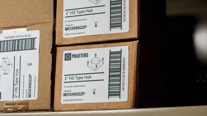 Stacked cardboard shipping boxes with thermal barcode labels