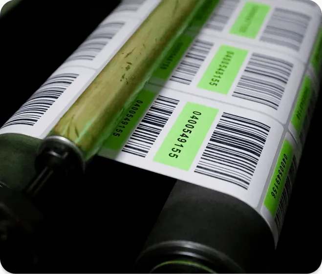 a web of barcode labels flowing through a machine
