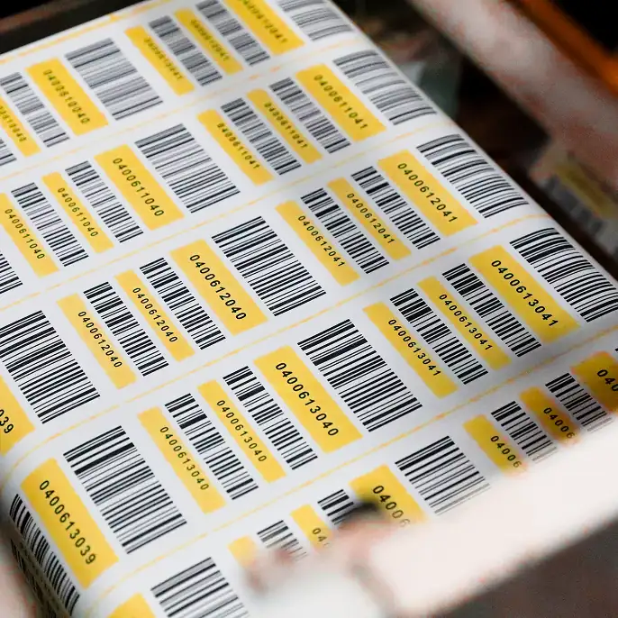 a sheet of custom thermal labels in a printing press