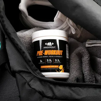 a tub of pre-workout in a workout bag