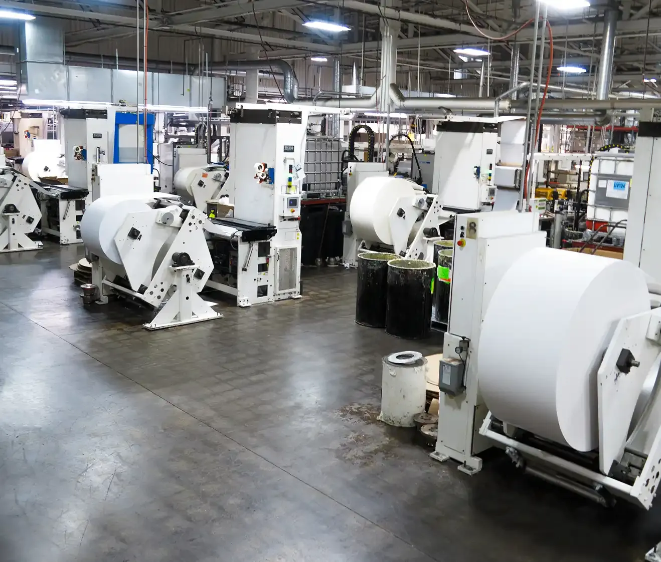 Wide view of large manufacturing machines in a factory setting