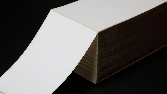 Fanfold direct thermal labels stacked and ready for printing