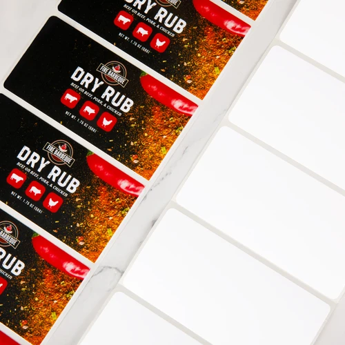 Stacked bottles of dry rub spices with product labels featuring vibrant packaging design arranged diagonally
