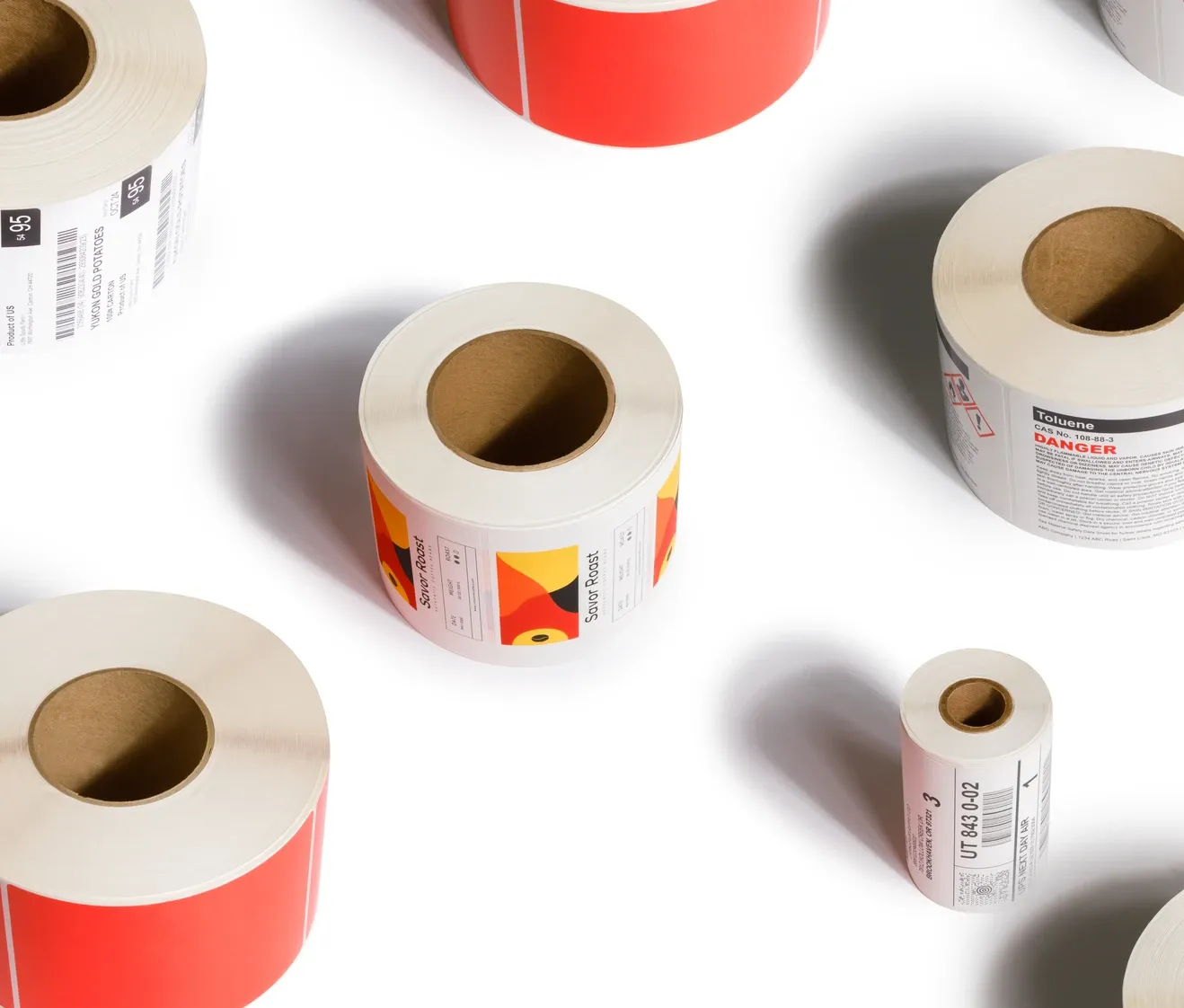 Various colorful label rolls and thermal transfer ribbons showcasing our product offerings