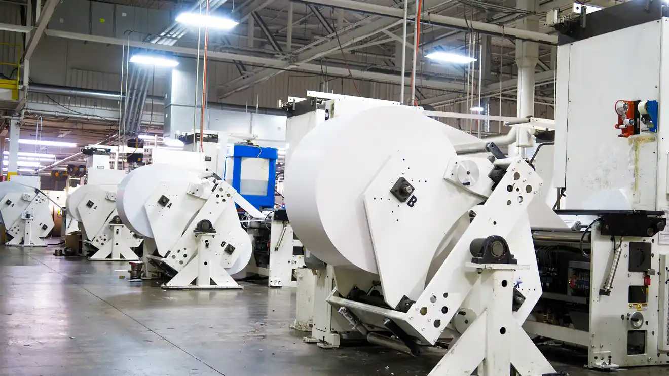 large printing presses on the factory floor