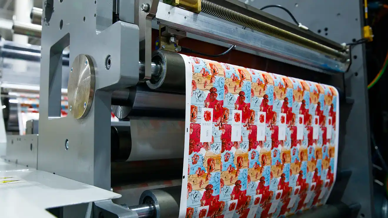 colorful labels coming out of a Bobst printing press