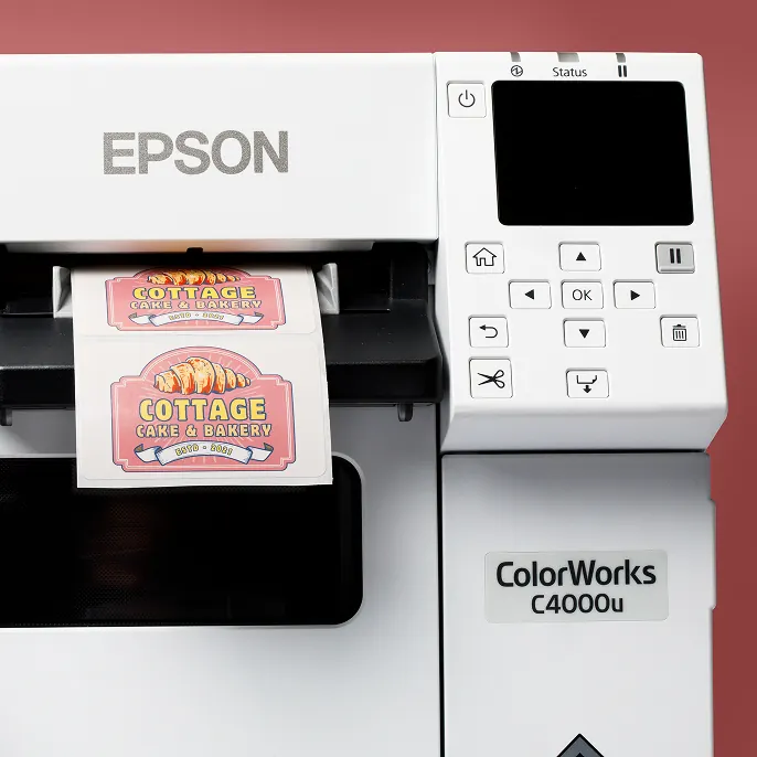 Orange LPN barcode label on cardboard box with hand holding it