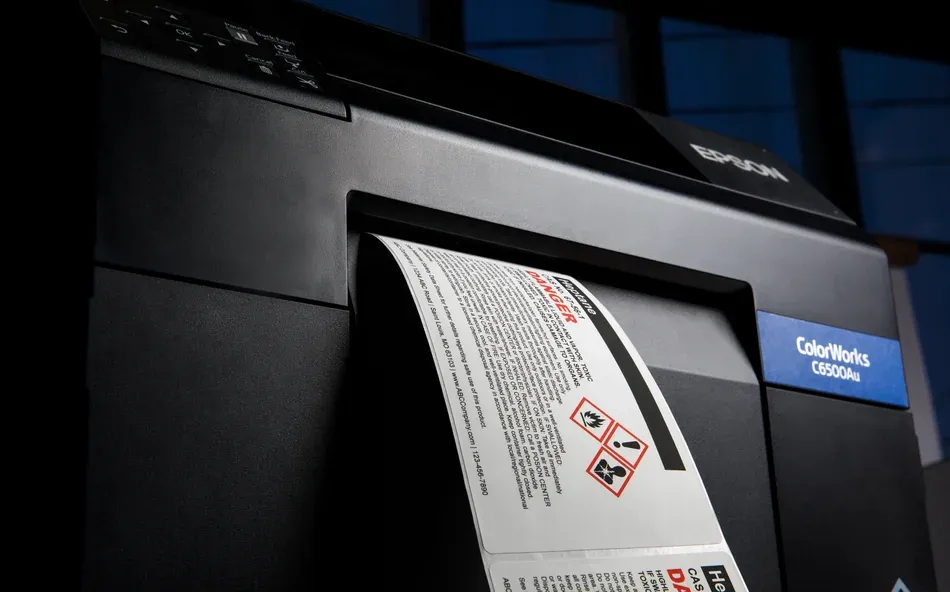 chemical labels coming out of a printer