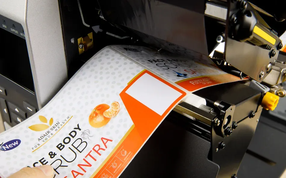 laminated label being applied to product