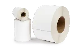 Colorful thermal label rolls in red, orange, yellow and white arranged on white background