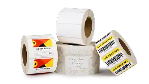 Rolls of inkjet labels featuring colorful product labels and barcode designs