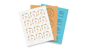 Stack of sheet labels with various printed designs in white, orange and blue