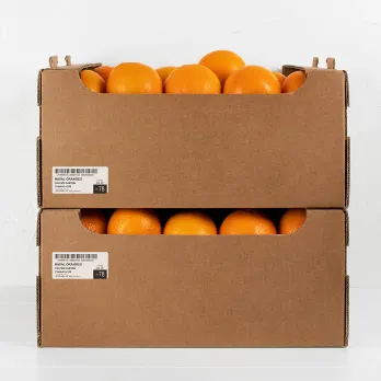 stacked, labeled cardboard boxes filled with fresh oranges