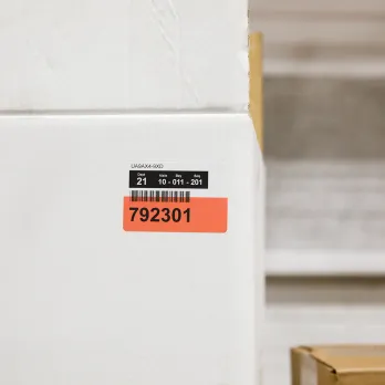 adhesive label on cardboard box showing product information