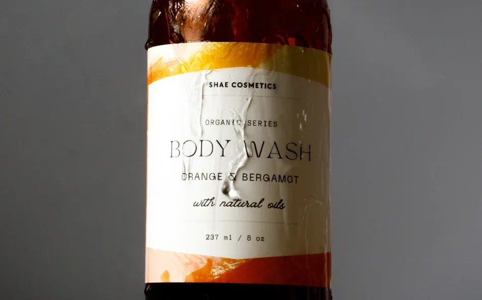 a polypropylene label on a wet bottle of body wash