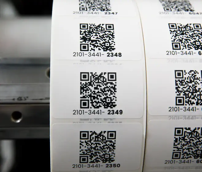 a very large roll of preprinted QR code labels