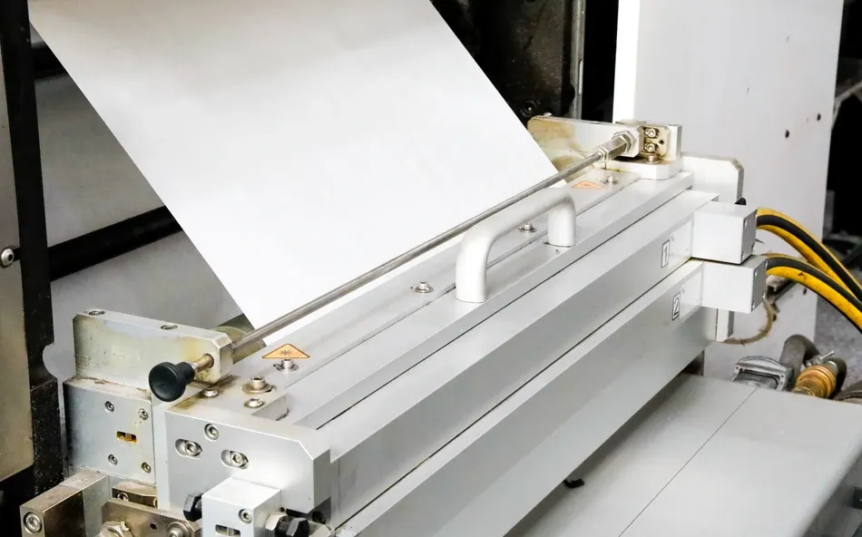 Silicone coating machinery applying coating to paper liner