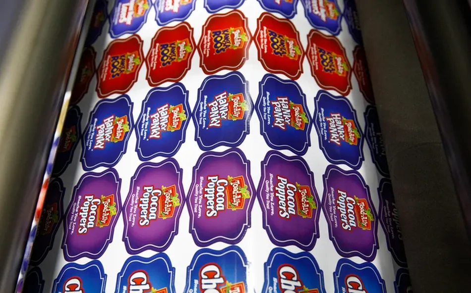 Digital printing press applying graphics to label material