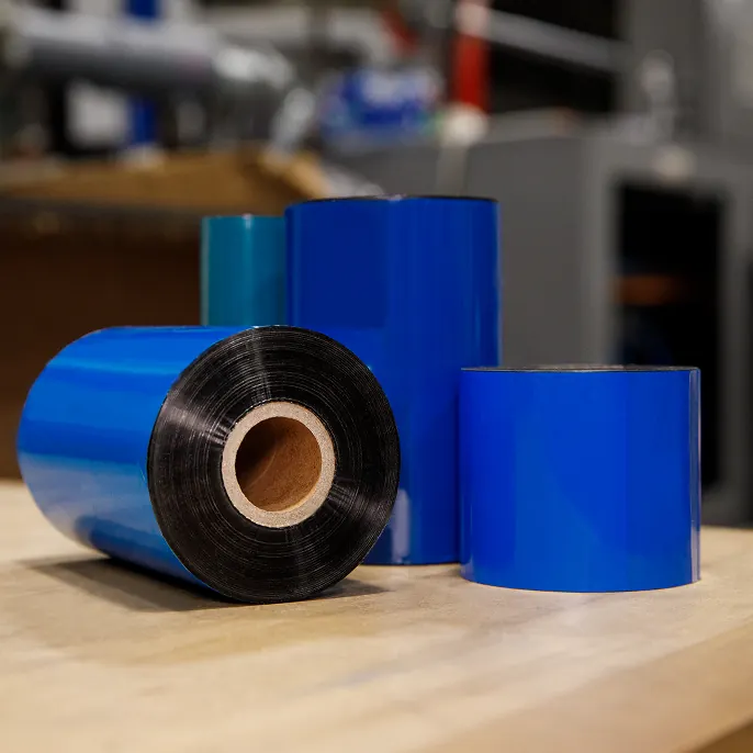 Orange LPN barcode label on cardboard box with hand holding it