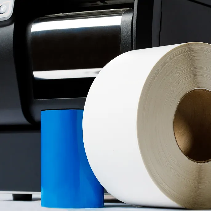 Orange LPN barcode label on cardboard box with hand holding it