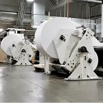 a montage of labels being printed and packaged in a factory