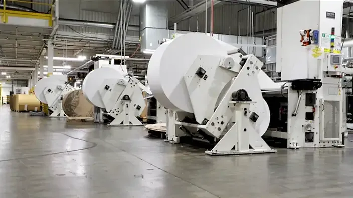 a montage of labels being printed and packaged in a factory