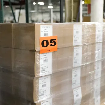 Warehouse pallet with orange label showing number 05